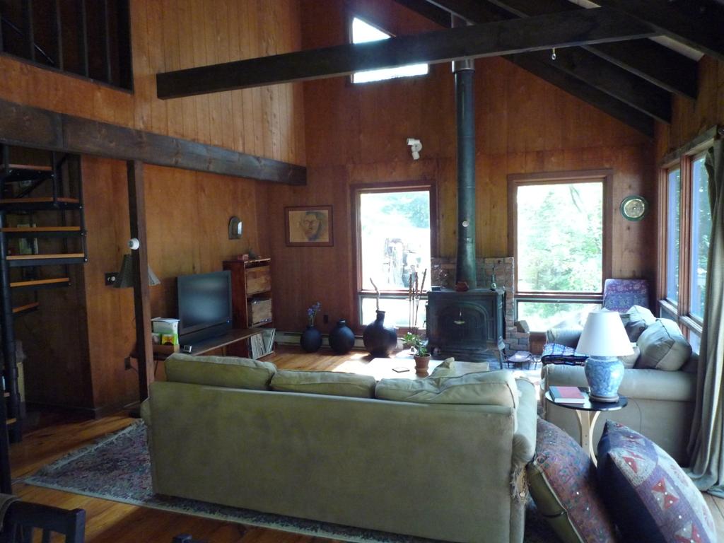 172 Rathbun Road Hancock, MA 01267 - Photo 2 of 12 a living room with furniture and a large window
