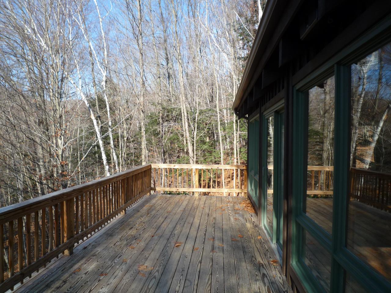 172 Rathbun Road Hancock, MA 01267 - Photo 7 of 12 a view of balcony with wooden floor
