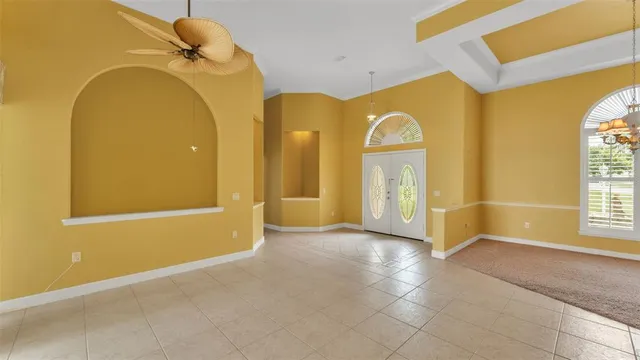 a view of a bathroom with a tub and a large window