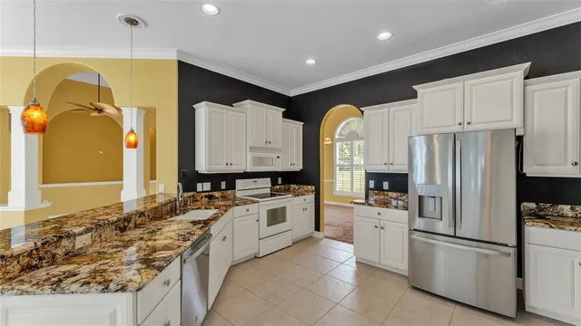 a bathroom with a tub a sink and a window