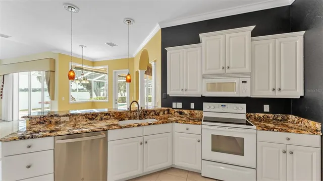 a spacious bathroom with a granite countertop tub and a sink