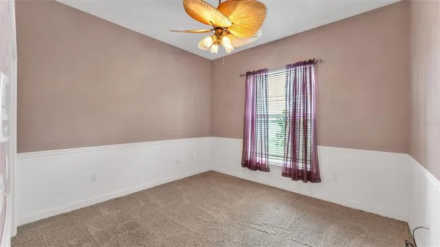 a view of a kitchen with white cabinets