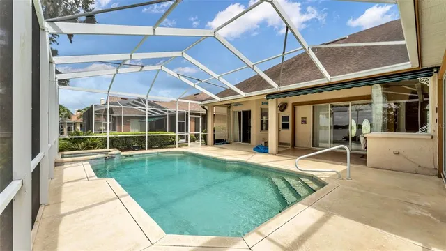 a view of a backyard with table and chairs and garden