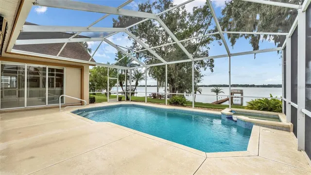 an aerial view of a house with garden space and street view