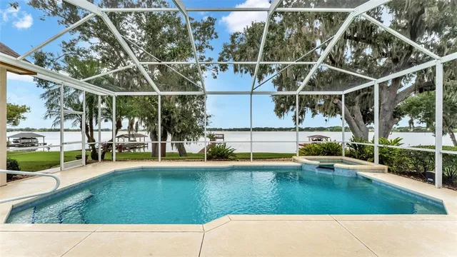 a view of a house with a big yard and potted plants