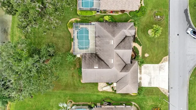 an aerial view of a house with a lake view