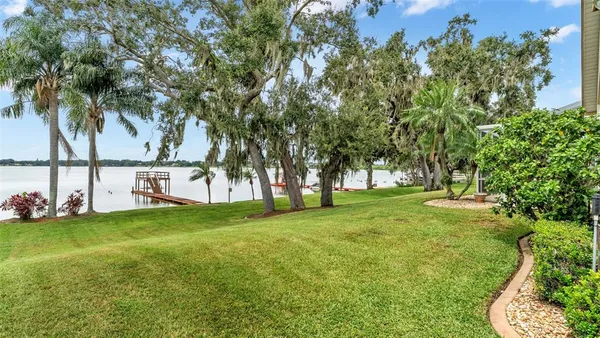 an aerial view of houses with yard