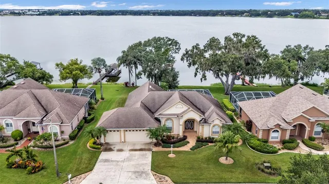 an aerial view of a house with garden space and outdoor seating