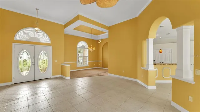 a view of an entryway with a chandelier