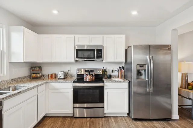 a view of a dining room with furniture and a window