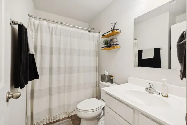 a view of a porch with a table and chairs