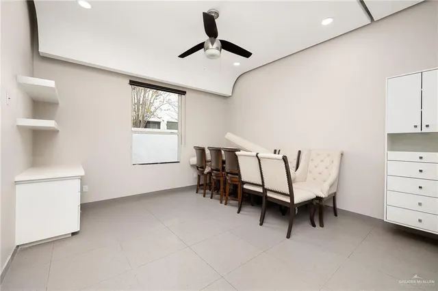 a dining room with furniture and window