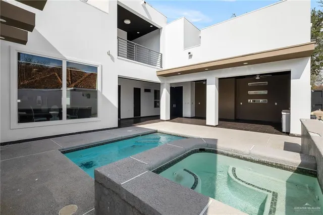 a view of a white house with a yard