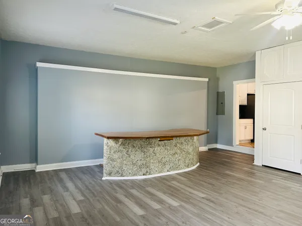 a view of a livingroom with wooden floor