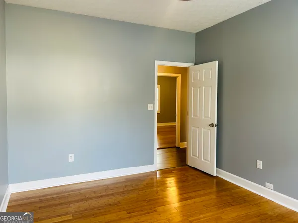a view of a small space with wooden floor