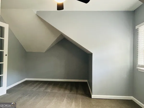 wooden floor and window in an empty room