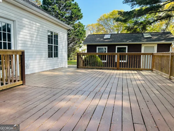 a view of a house with wooden deck