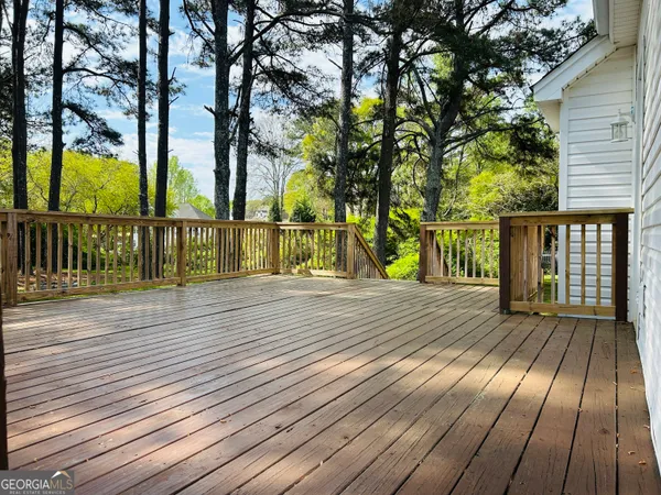 a view of a wooden deck with a bench
