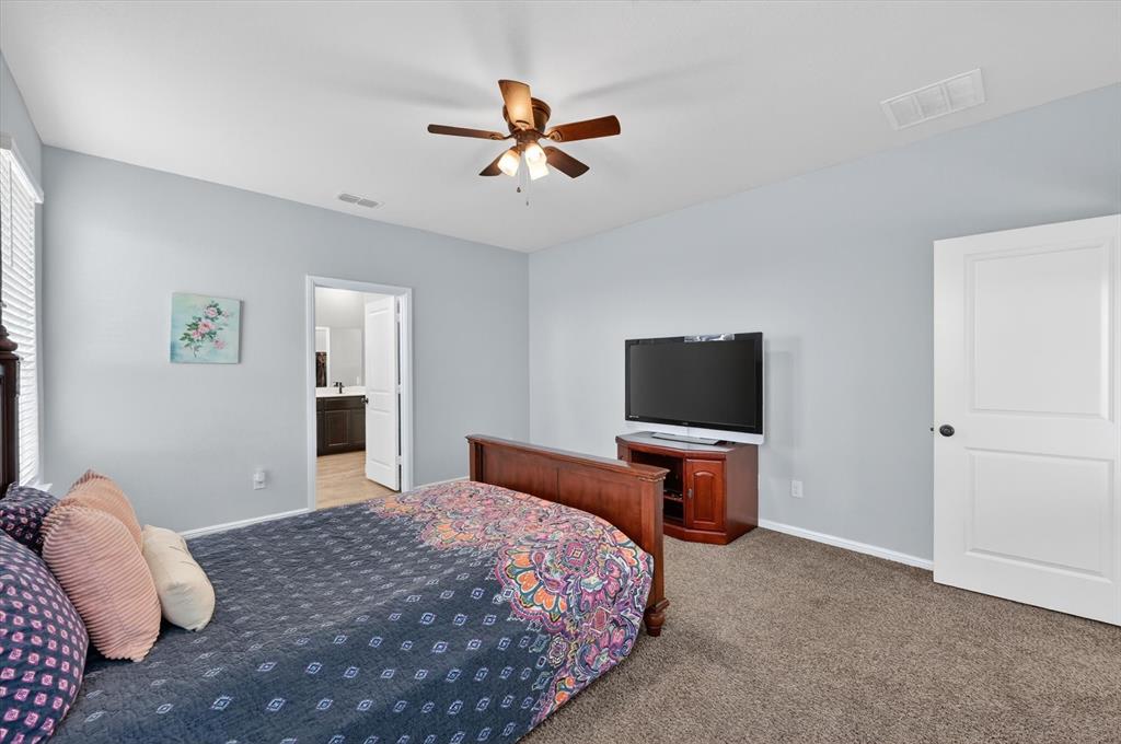 9604 Cherryville Road Fort Worth, TX 76108 - Photo 19 of 40 Carpeted bedroom with a ceiling fan light fixture