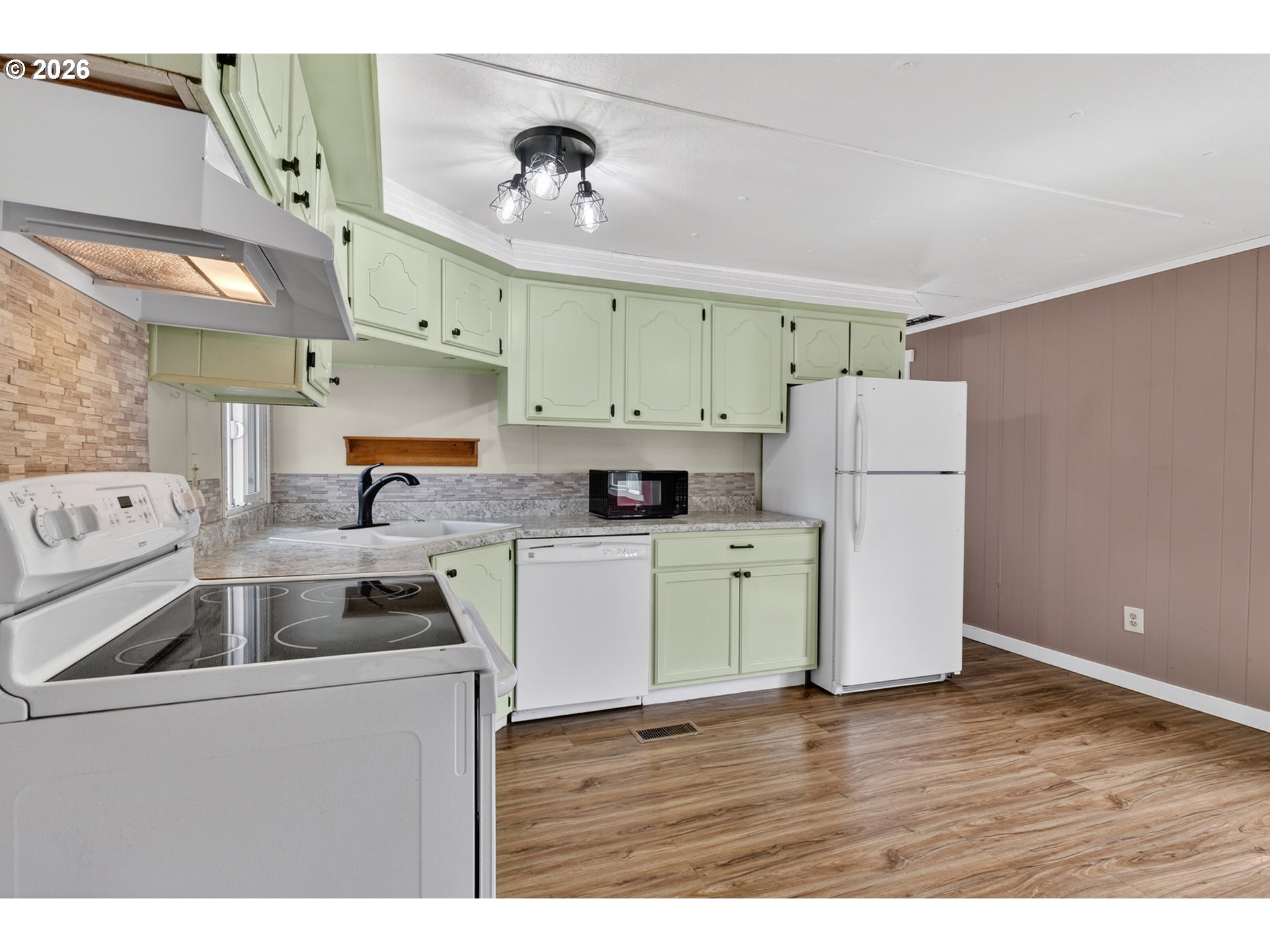 205 South 54th Street, Unit 80 Springfield, OR 97478 - Photo 11 of 37 a kitchen with a refrigerator and a sink