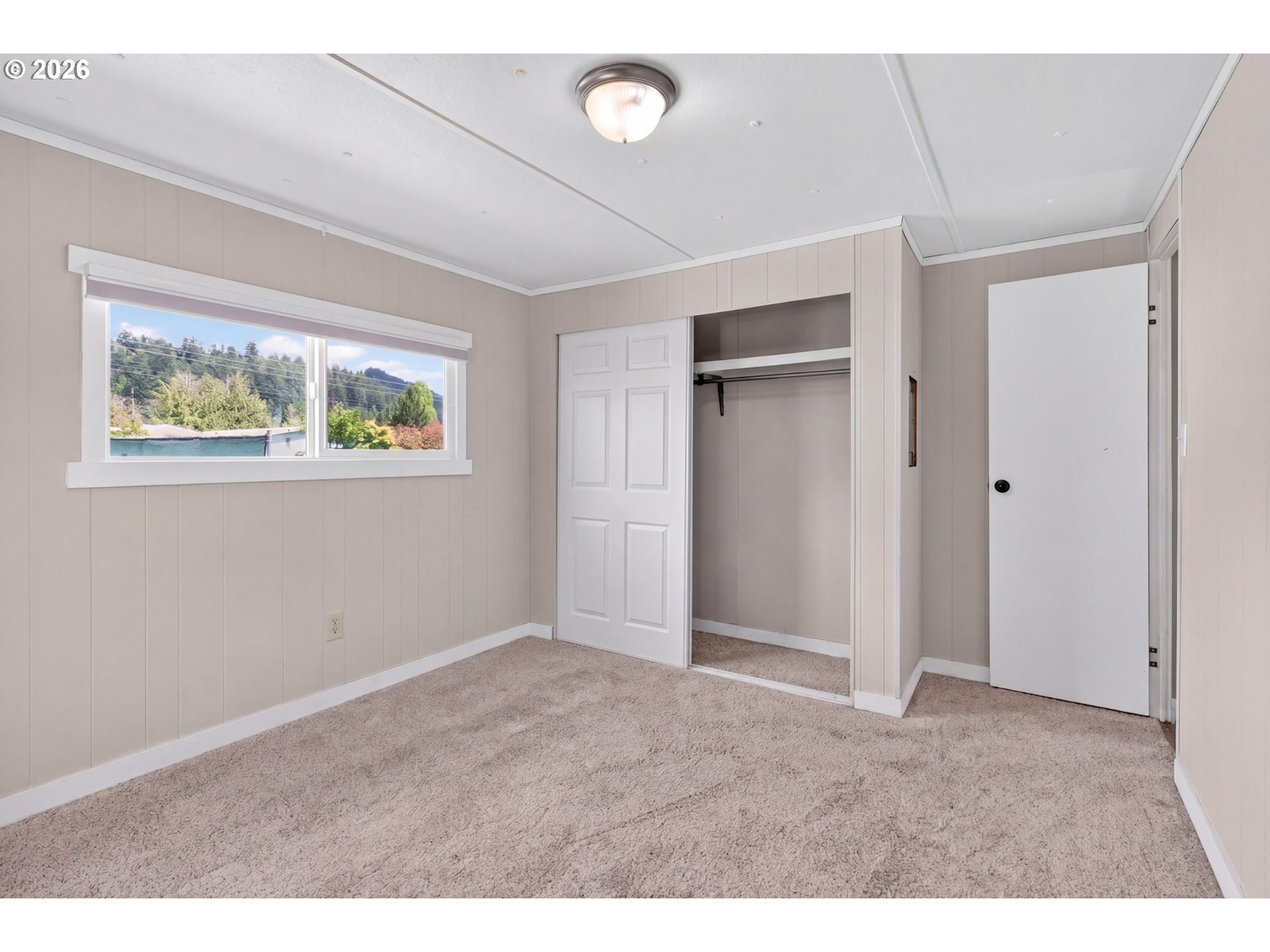 205 South 54th Street, Unit 80 Springfield, OR 97478 - Photo 19 of 37 a view of an empty room with a window