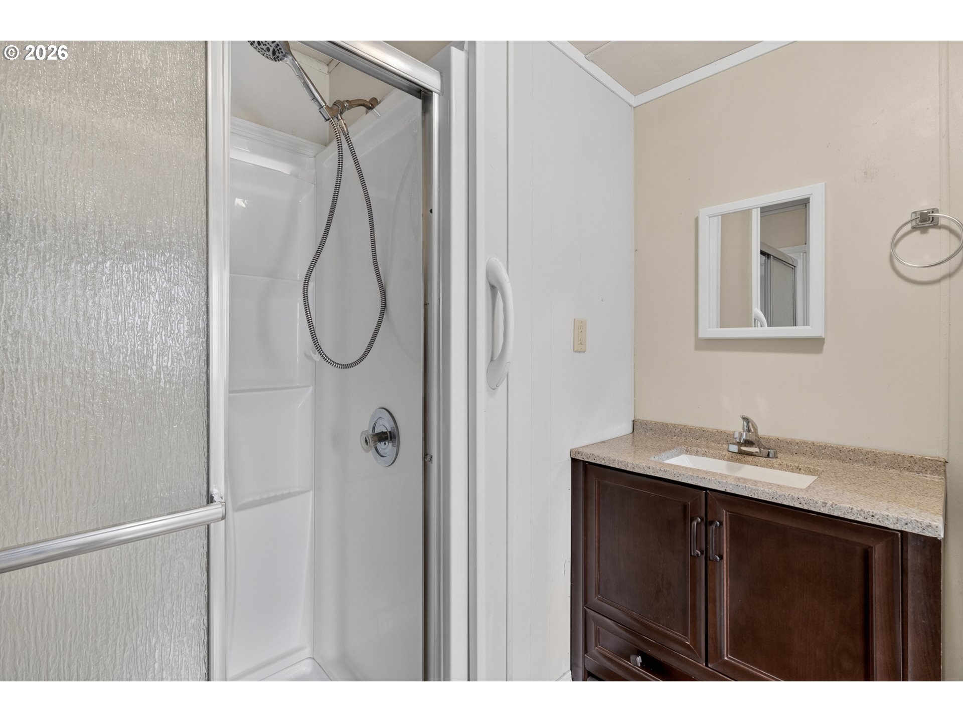 205 South 54th Street, Unit 80 Springfield, OR 97478 - Photo 22 of 37 a bathroom with a sink vanity and shower