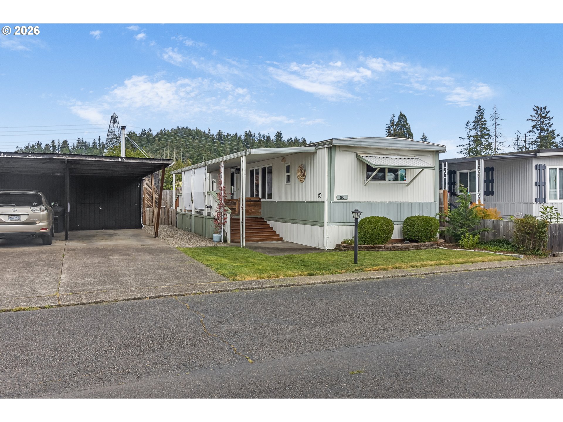 205 South 54th Street, Unit 80 Springfield, OR 97478 - Photo 33 of 37 a view of a house with a yard and plants