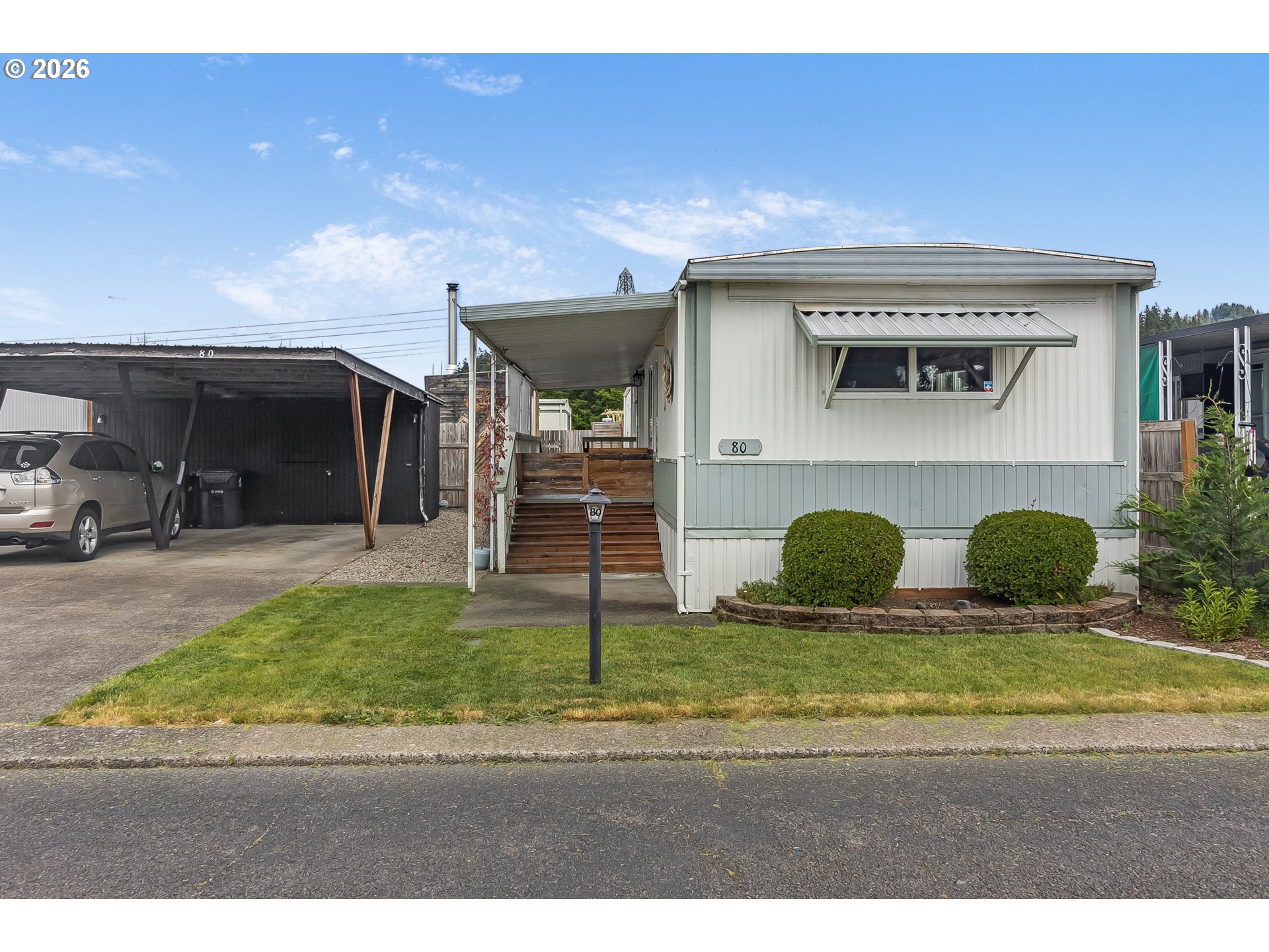 205 South 54th Street, Unit 80 Springfield, OR 97478 - Photo 34 of 37 a view of a car park in front of house