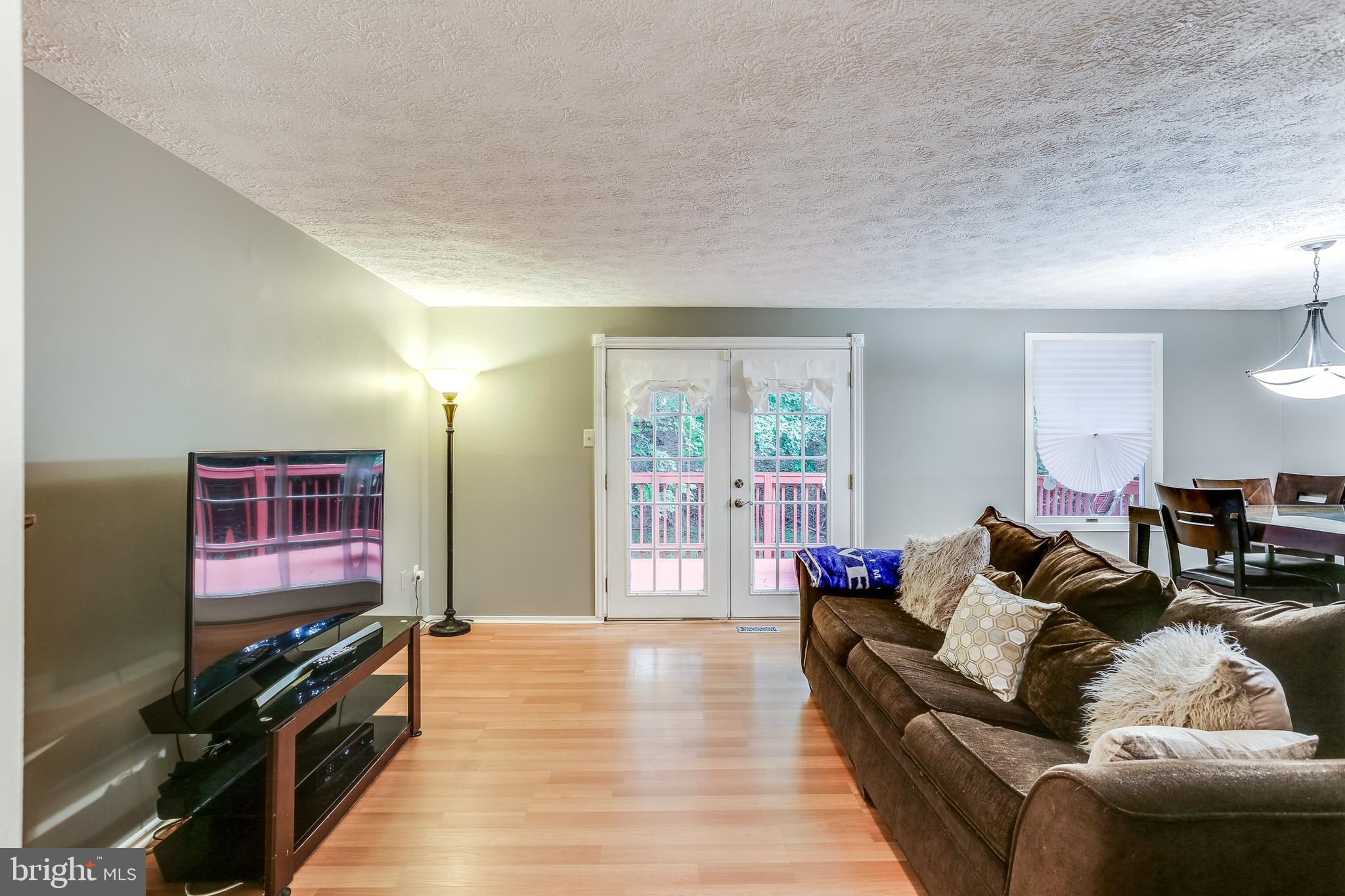 4821 Hawksbury Road Baltimore, MD 21208 - Photo 14 of 32 Large Family Room with Wood floors