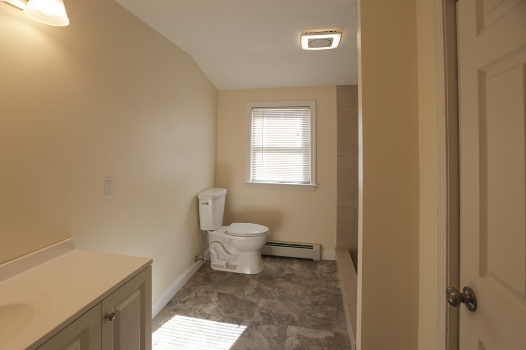 7 Pickman Road Salem, MA 01970 - Photo 12 of 25 a bathroom with a toilet a sink and a window