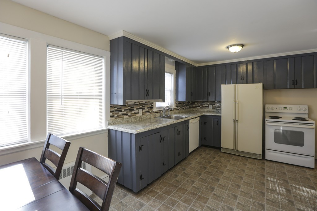 7 Pickman Road Salem, MA 01970 - Photo 17 of 25 a kitchen with a stove a refrigerator and a sink