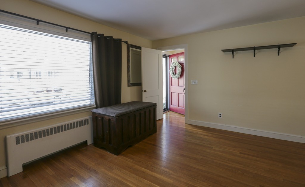 7 Pickman Road Salem, MA 01970 - Photo 4 of 25 a view of an empty room with wooden floor and a window