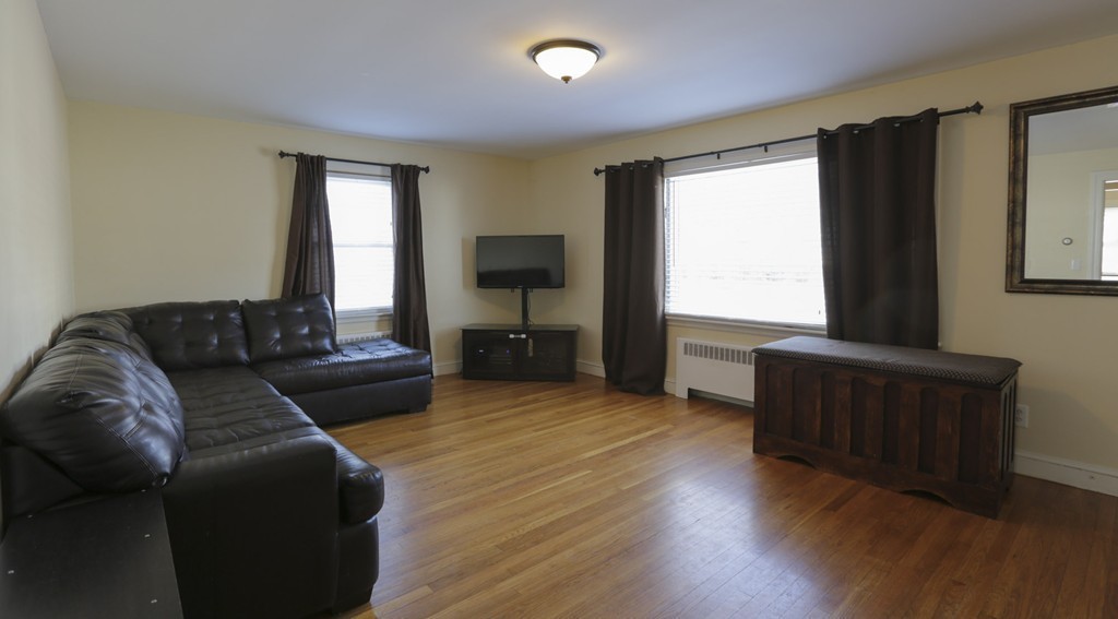 7 Pickman Road Salem, MA 01970 - Photo 5 of 25 a living room with furniture and a flat screen tv