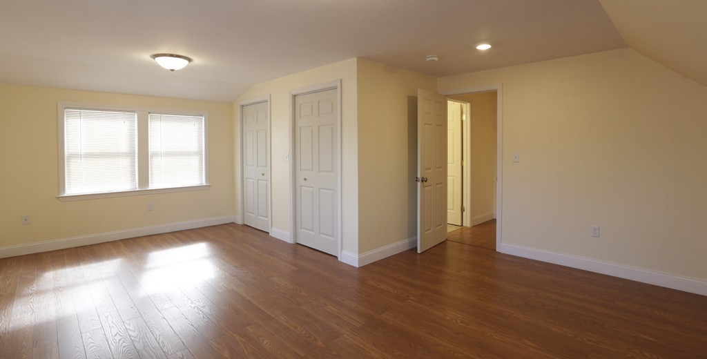 7 Pickman Road Salem, MA 01970 - Photo 6 of 25 a view of an empty room with wooden floor and a window