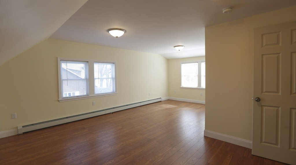 7 Pickman Road Salem, MA 01970 - Photo 7 of 25 an empty room with wooden floor and windows
