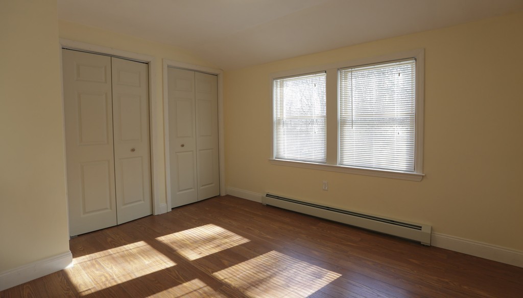 7 Pickman Road Salem, MA 01970 - Photo 8 of 25 a view of an empty room with wooden floor and a window