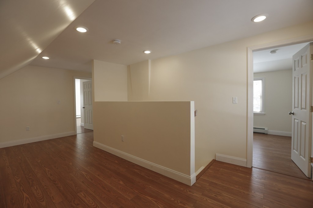 7 Pickman Road Salem, MA 01970 - Photo 9 of 25 a view of an empty room with wooden floor and a bathroom