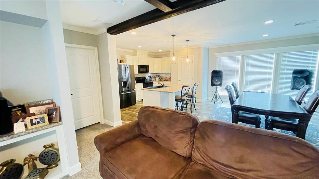 8394 Lake Road Mansfield, TX 76063 - Photo 6 of 22 a living room with furniture and kitchen view