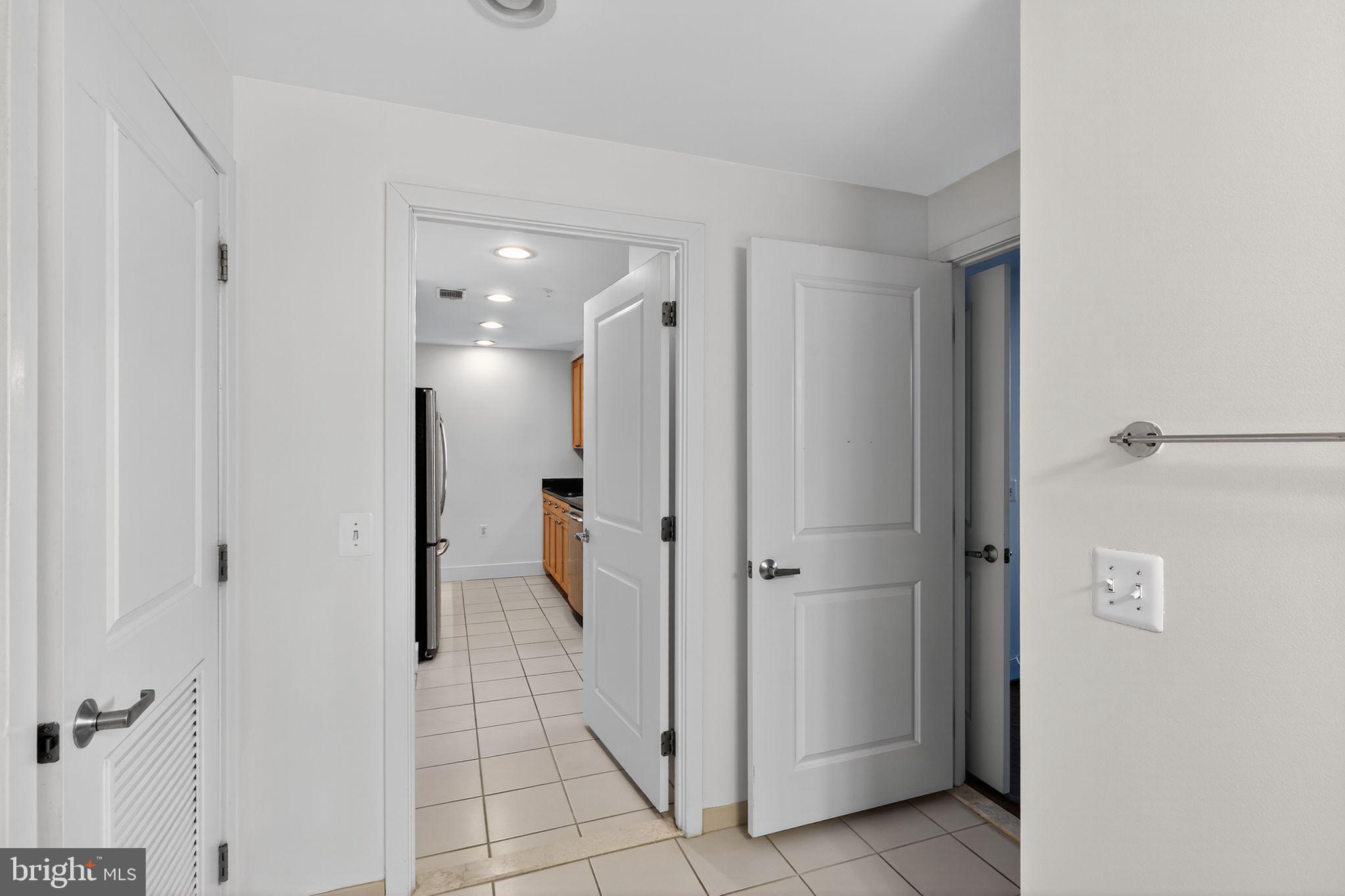 2001 15th Street North, Unit 420 Arlington, VA 22201 - Photo 17 of 27 a bathroom with a shower and a glass door