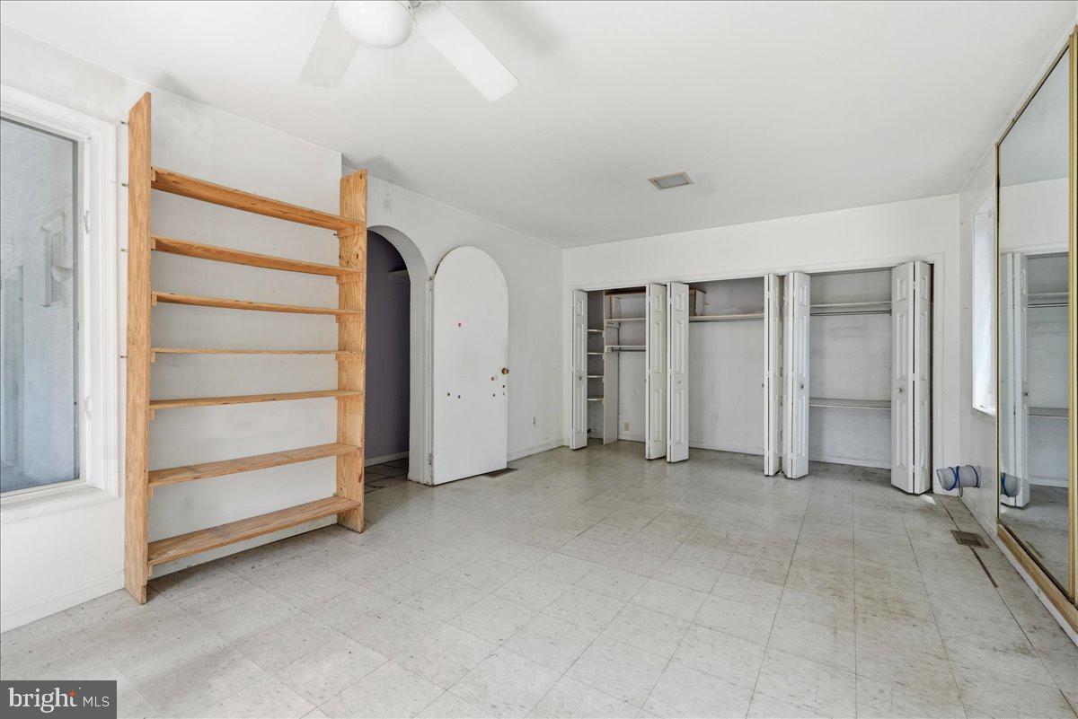 73 Church Road Arnold, MD 21012 - Photo 16 of 29 an empty room with closet and mirrors