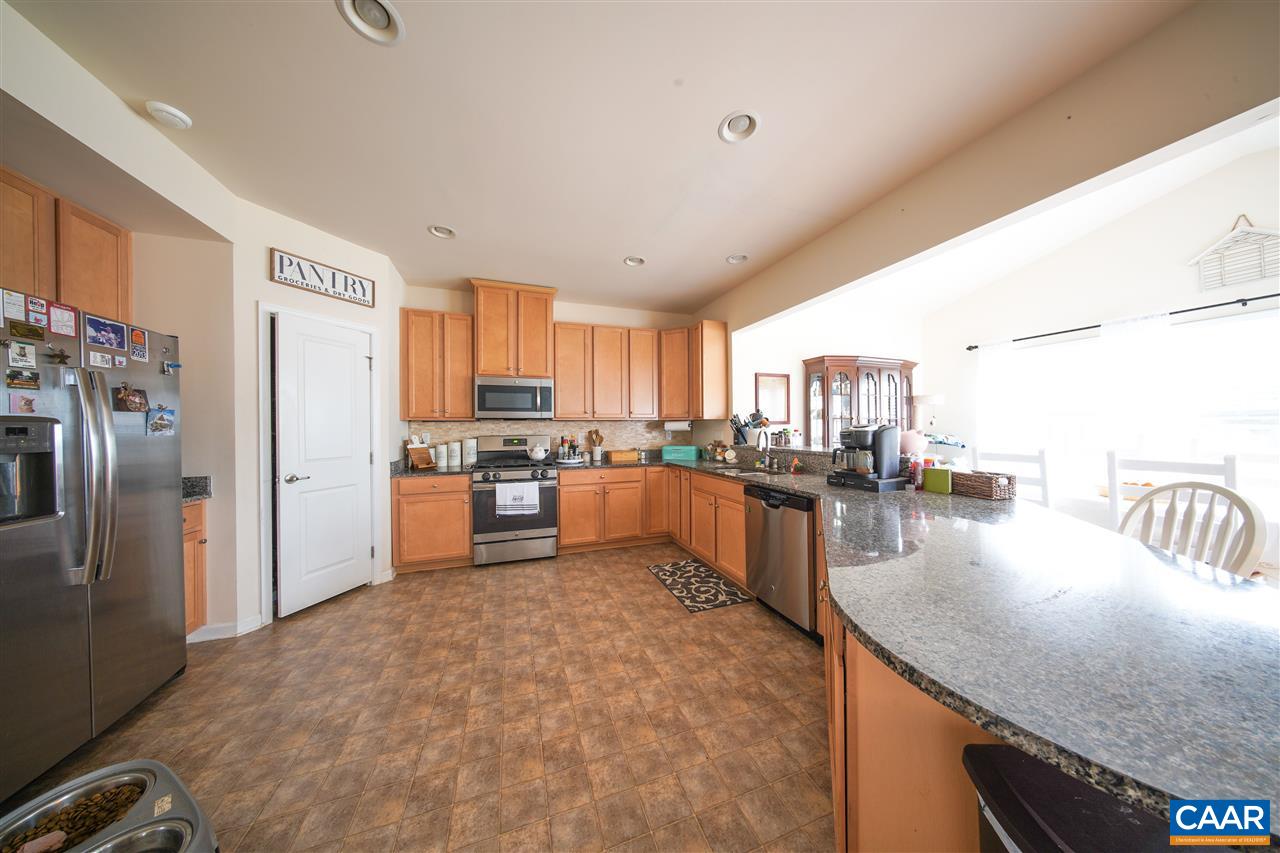 38 Ridgemont Road Ruckersville, VA 22968 - Photo 15 of 47 a kitchen with stainless steel appliances granite countertop a refrigerator a stove and a sink