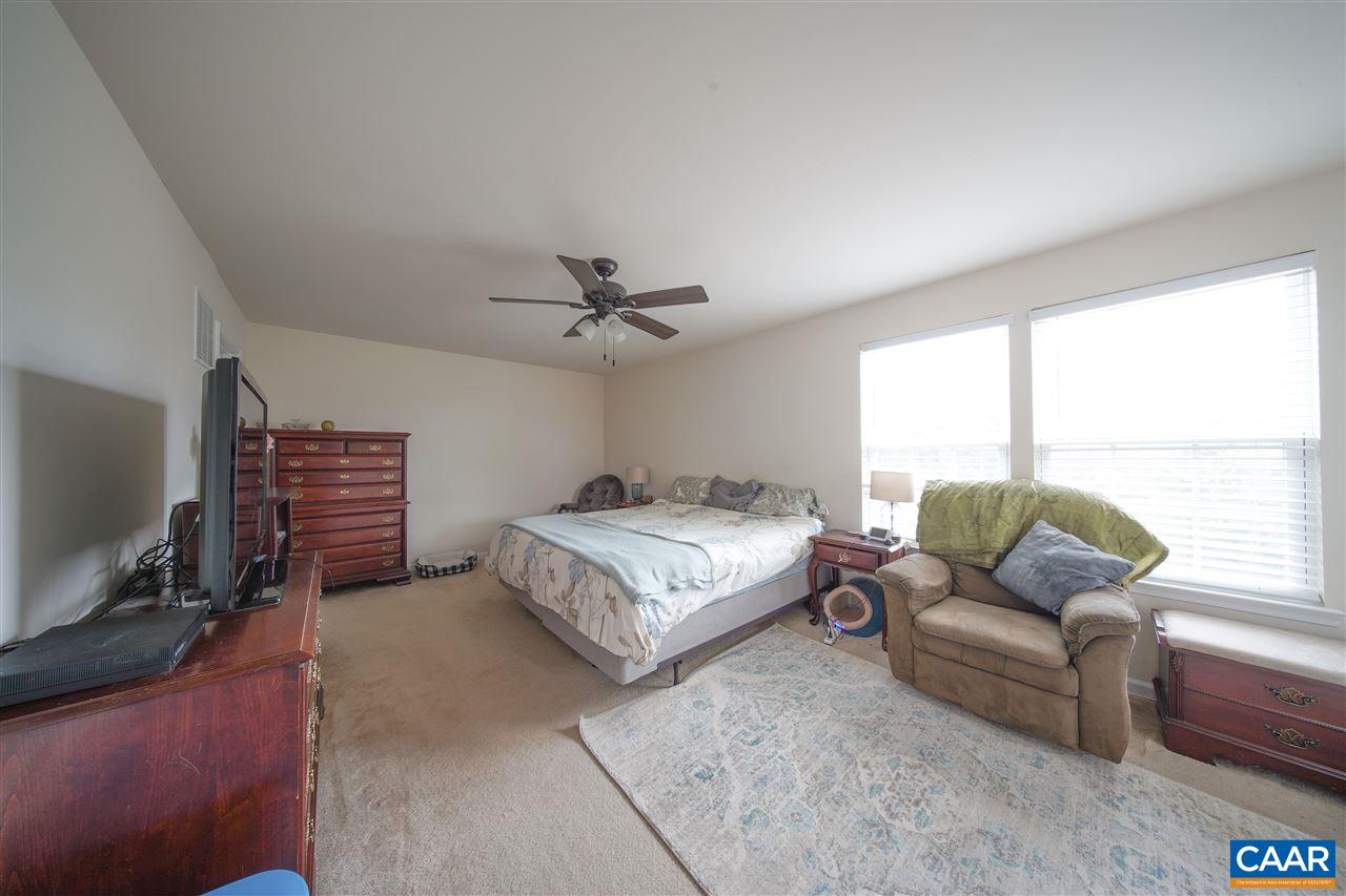 38 Ridgemont Road Ruckersville, VA 22968 - Photo 23 of 47 a bedroom with a bed couch and window