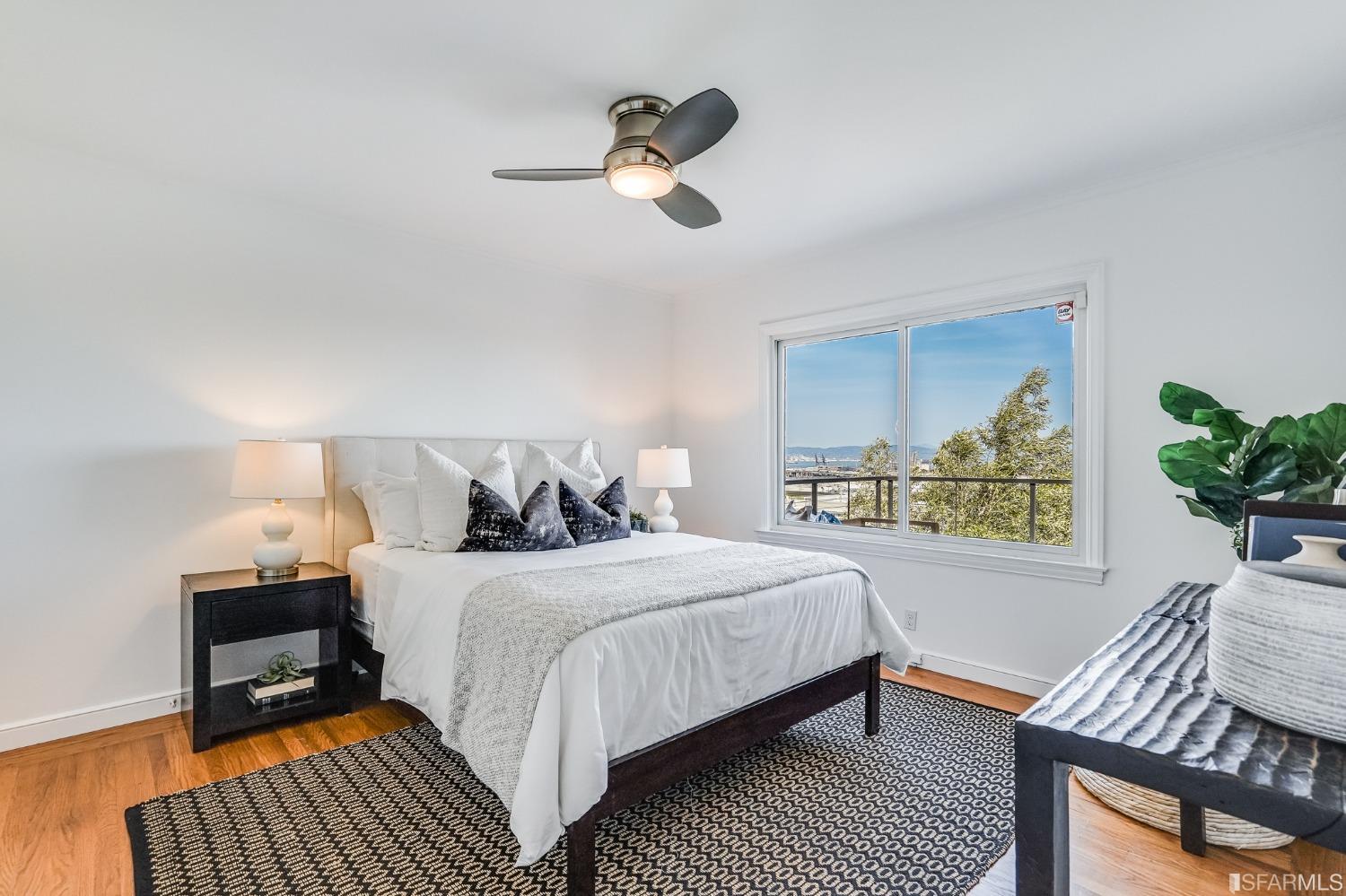 91 Bronte Street San Francisco, CA 94110 - Photo 11 of 24 a bedroom with bed and a window