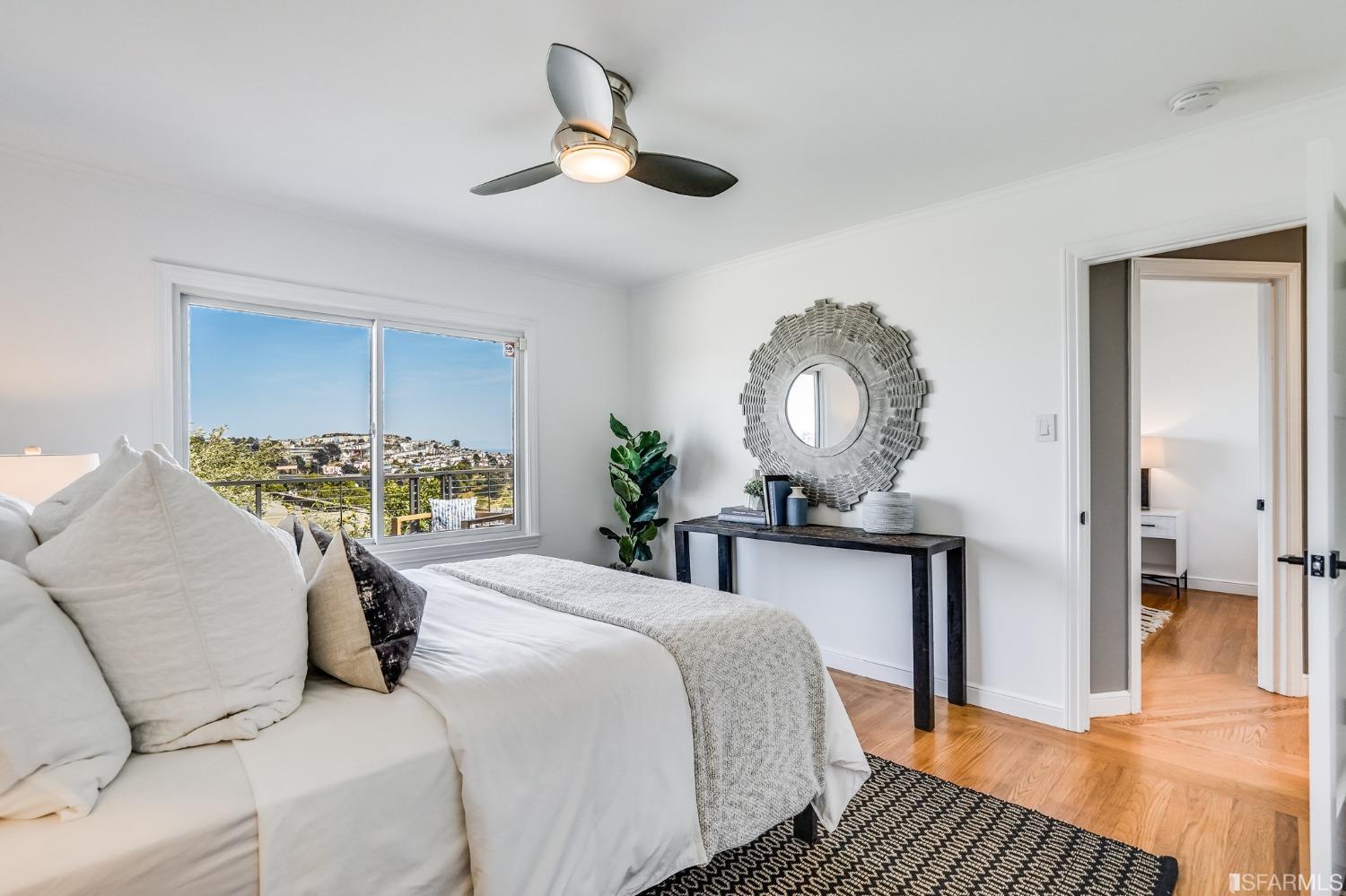 91 Bronte Street San Francisco, CA 94110 - Photo 12 of 24 a bed room with a bed mirror and a table
