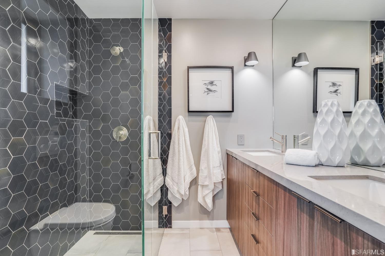 91 Bronte Street San Francisco, CA 94110 - Photo 15 of 24 a bathroom with a granite countertop sink and a mirror