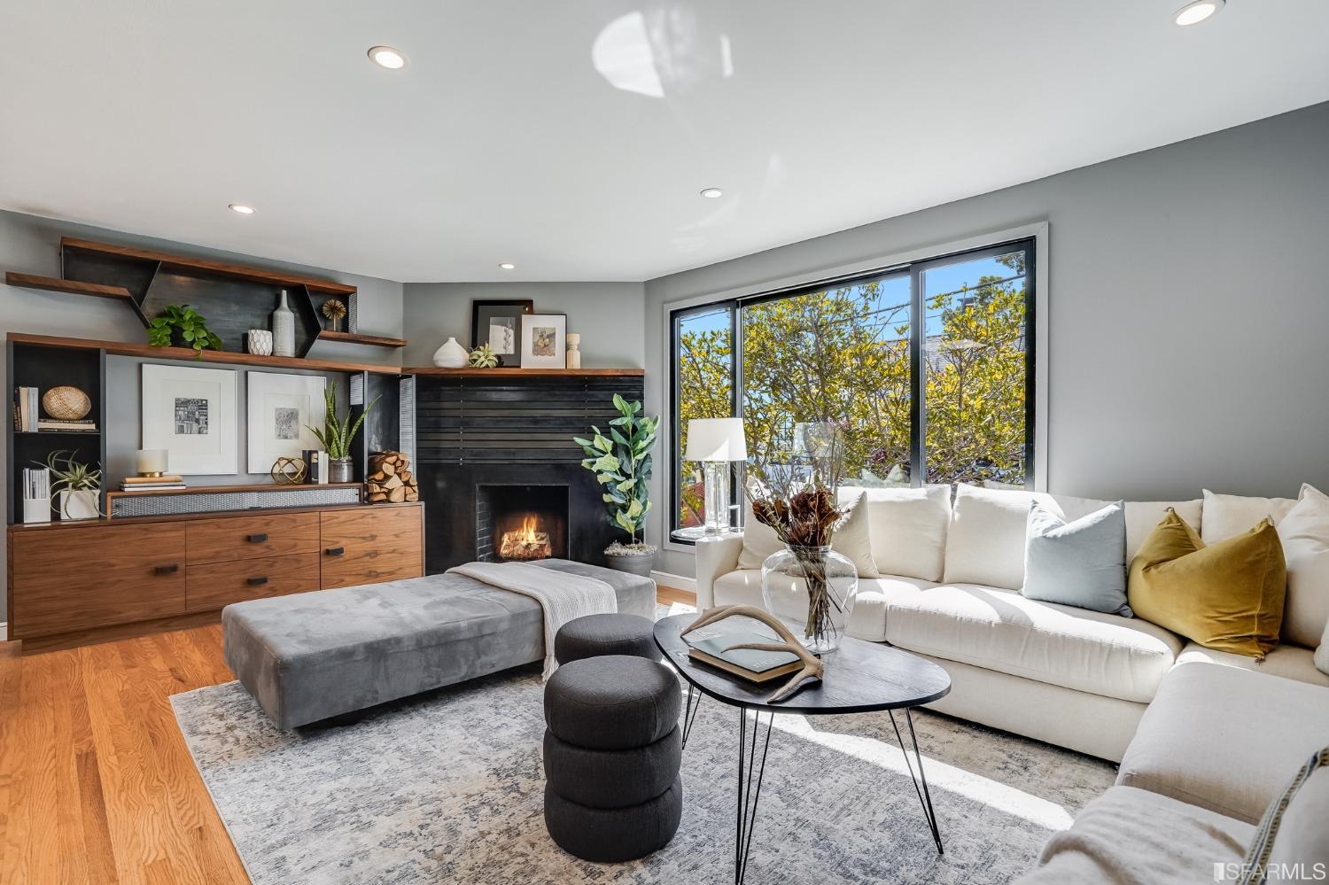 91 Bronte Street San Francisco, CA 94110 - Photo 2 of 24 a living room with furniture and a fireplace