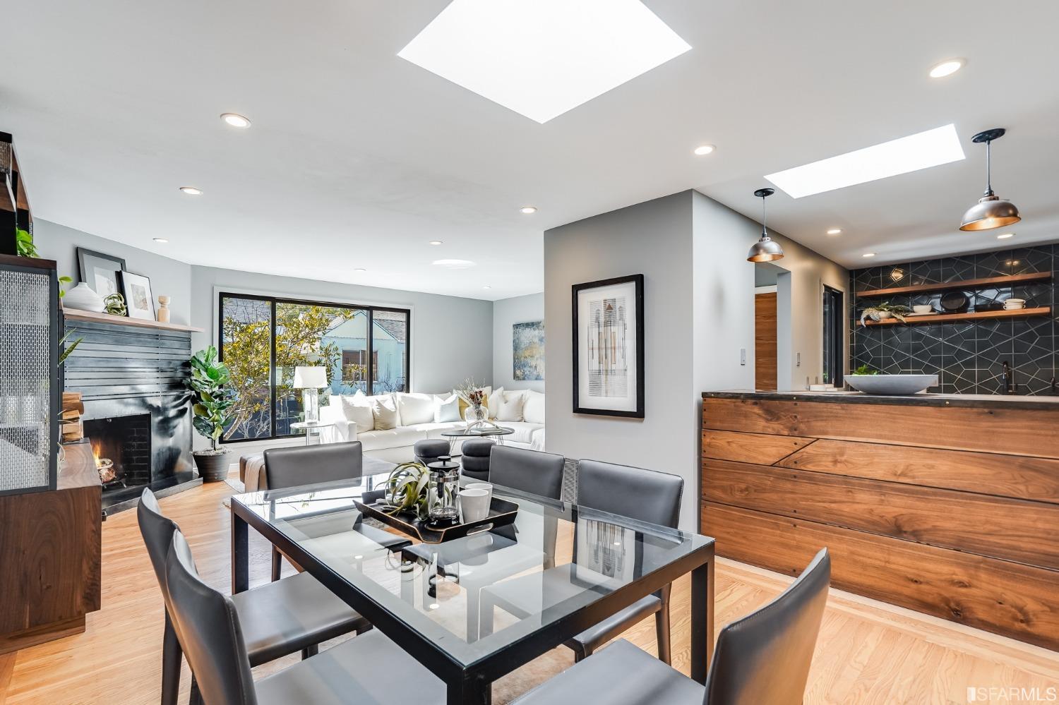 91 Bronte Street San Francisco, CA 94110 - Photo 6 of 24 a living room with fireplace furniture and a large window