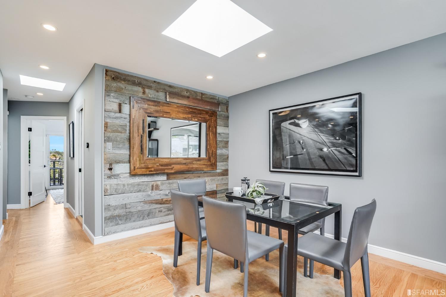 91 Bronte Street San Francisco, CA 94110 - Photo 7 of 24 a view of a dining room with furniture large window and wooden floor