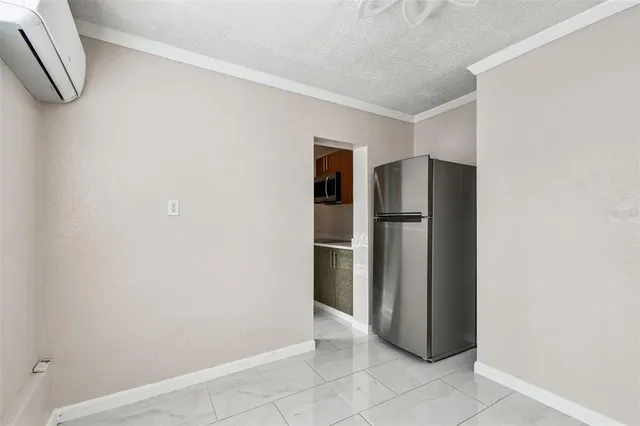 a view of a refrigerator in a kitchen