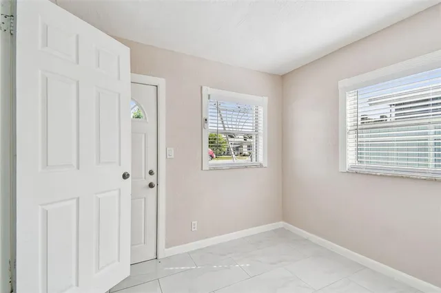 an empty room with windows